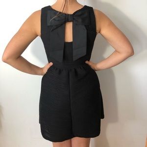 Candies simple pleaded black dress with back bow.